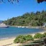 A boat arriving at the wharf in front of Daydream Island resort