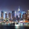 New York City Manhattan skyline panorama at night over Hudson River with refelctions viewed from New Jersey