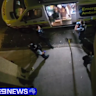 Video shows a distressed Collin Burling asking police to move away from the ambulance so that he can exit the vehicle. A second clip shows Burling on the ground with four officers on top of him, telling him to stop resisting. This video has been edited for length and sensitivity.