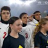 Iran's players were silent before their first match, but saluted the national anthem ahead of the second game against Australia.
