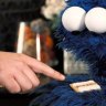 Cookie Monster eats an Iced VoVo for the first time.