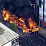 Bus set on fire during Belfast protests the night after an asylum seeker was charged with attempted murder in a brutal stabbing attack.
