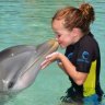 SHD TRAVEL september 8 family edition shore excursion jane fraser. Dolphin encounter and water park adventure at Atlantis REsort in the Bahamas- dolphin encounter -  Hannah Haxton aged nine SUPPLIED