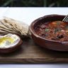 Kafta Tagine Eggs: clay pot-baked eggs with spiced lamb kafta tagine served with pita and labna. 