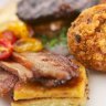 British breakfast of Scotch egg, black pudding and Welsh rarebit with home-made HP sauce.