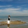 Stephen Tuohy looks for bird nestings on Mud Island.